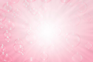 Beautiful blurry clear pink soap bubbles float background with copy space.