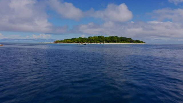 Drone Low Approach to Mantigue Island Camiguin Philippines