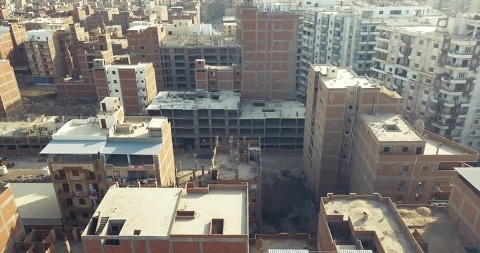 Aerial view of construction workers work on top of the building at construction.