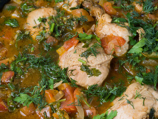 Chokhokhbili. Caucasian dish of chicken stew with bones with various spices. Home traditional cuisine