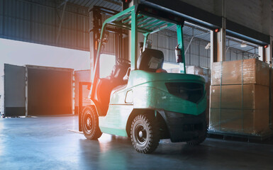 Forklift on parking at the warehouse. Distribution warehouse, Cargo freight shipment transport and logistics.