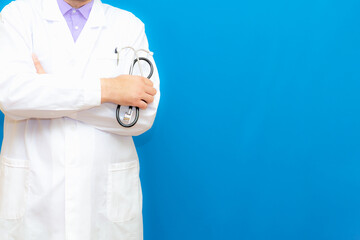 Cropped view of Doctor in uniform standing and holding a stethoscope. Copy space for your text