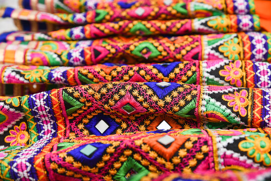 Colourful Indian traditional ethnic ware for woman or girls Gujarat, India. Handmade tribal skirt with embroidery, mirror work. Wedding dress of rural women. multi color design party wear, Rajasthan.