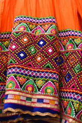Colourful Indian traditional ethnic ware for woman or girls Gujarat, India. Handmade tribal skirt with embroidery, mirror work. Wedding dress of rural women. multi color design party wear, Rajasthan.