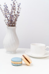 macarons on background Cup and vase with lavender.