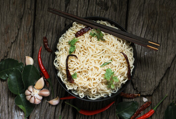Noodles in bowl on wooden. Asian style of food.