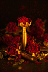 Grunge - Brass bullet casings and dried roses with grunge texture.