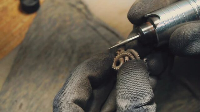 1080p.HD-60p. close-up partial view of jeweler making a silver ring 