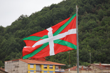 Basque flag flying in the village of Mundaka, Basque Country