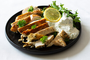 Greek Style Chicken with Salad and Tzatziki Sauce