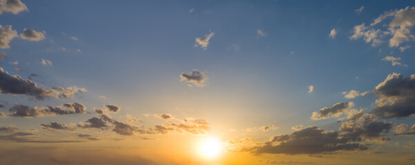 evening low sun on a cloudy sky, dramatic sunset background