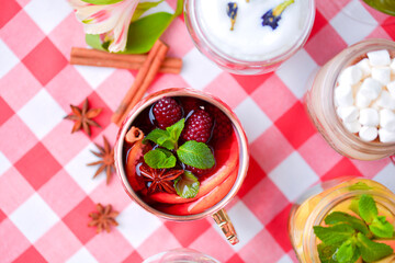 Unique and stylish cups of tea. Strawberry tea. Butterfly pea blue tea, mulled wine, fruit tea, latte coffee.