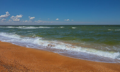 sandy sea beach with waves, summer sea vacation scene