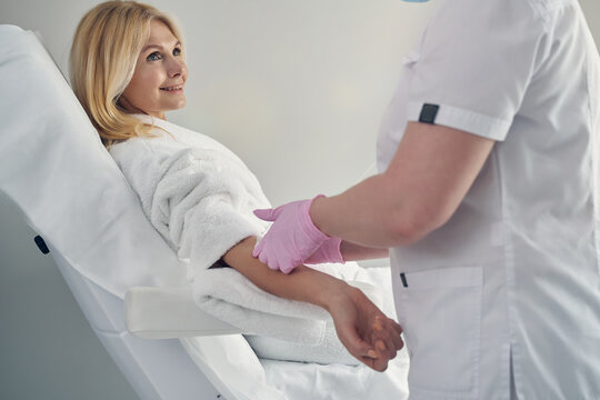 Positive adult woman taking care about her health