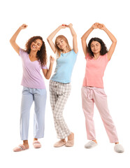 Obraz premium Beautiful young women in pajamas on white background