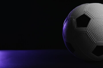 Soccer ball on dark background