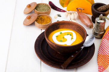 Vegetarian spicy cream soup with pumpkin. Studio Photo