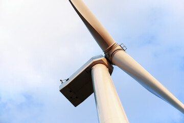 Windmill for electric power on sky background
