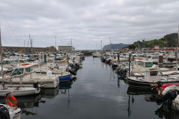 The magnificent port of Bermeo under a cloudy sky in the Basque Country