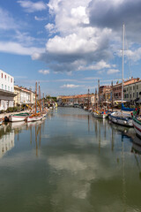 Fototapeta na wymiar The port canal designed by Leonardo da Vinci and old town of Cesenatico on the Adriatic sea coast