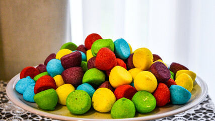 multicolored dragee candy on plate