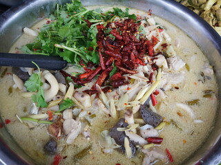 Top view of Thai traditional food Tom Kha Gai (Coconut Milk Soup With Chicken).