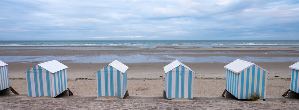 small striped beach huts in hardelot plage on the coast of normandy