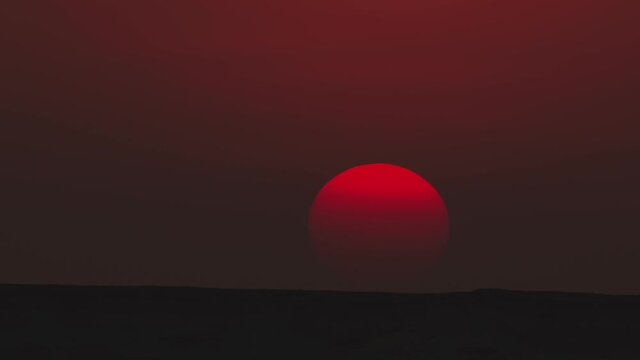 Extreme close up of the sun during a sunset in Zekreet desert in Qatar.