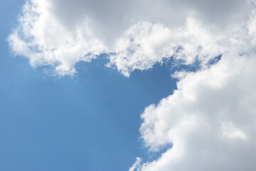 blue sky background with tiny clouds