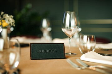 Reserve sign on the table in restaurant.