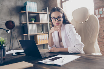 Portrait of her she nice attractive chic classy lady qualified specialist expert marketer hr director financier economist at modern industrial loft brick interior workplace workstation