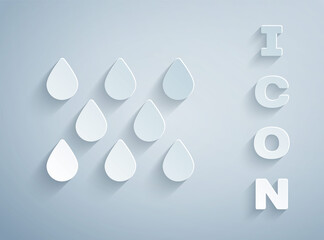 Paper cut Water drop icon isolated on grey background. Paper art style. Vector.