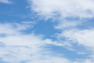 blue sky background with tiny clouds.