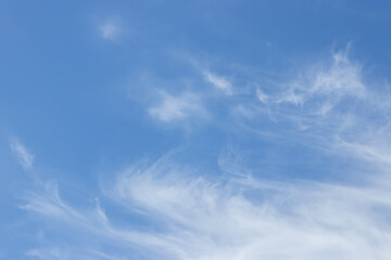 blue sky background with tiny clouds.