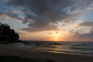 Beautiful clouds and bright sun over the sea coast