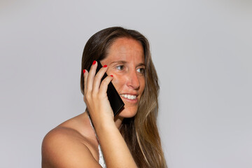 Smiling pretty young girl ,talking on cellphone ,happy, on isolated white background .