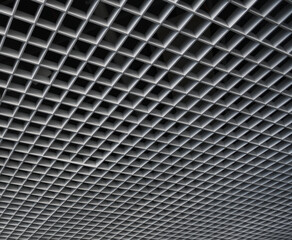 Grid structure of suspended ceiling in an mall building. Abstract modern architecture. 