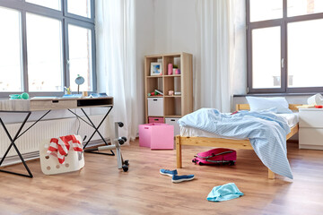 mess, disorder and interior concept - view of messy home kid's room with scattered stuff