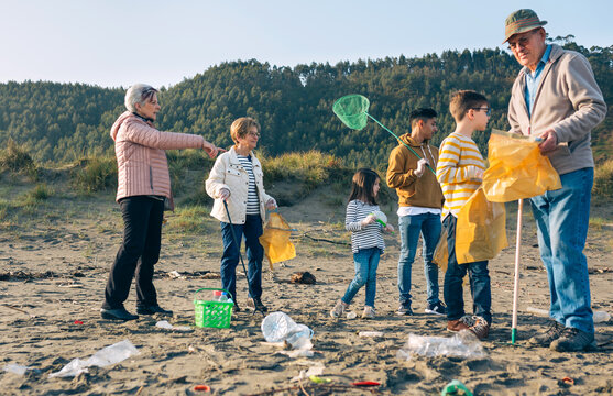 Group of volunteers preparing to clean the beach