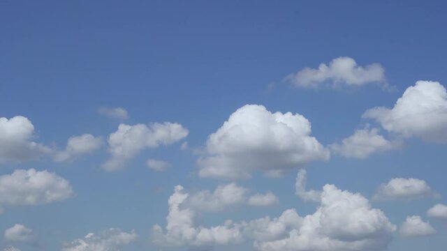 White Fluffy Clouds in a Clear Blue Sky during the Day, Fast Time Lapse of 4K Clouds. Pure Nitrogen Layer. Weather Forecast Cloud Cover.