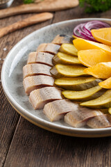 Russian platter with herring pickles and potatoes