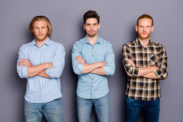 Portrait of three nice attractive serious content masculine guys best buddy fellow team colleagues folded arms isolated over gray purple pastel color background
