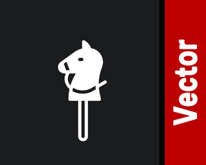 White Toy horse icon isolated on black background. Vector.