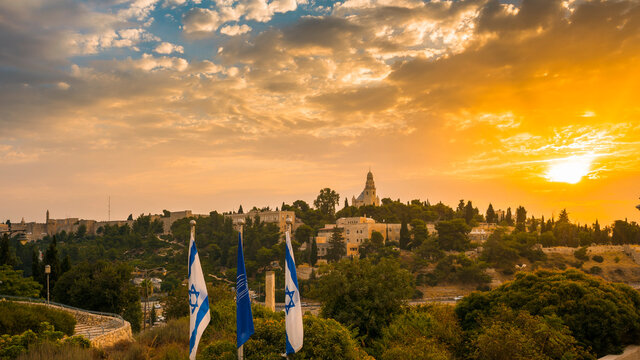 Beautiful sunrise over Mount Zion: Dormition Abbey, Jerusalem university college and greek ceminary; with the walls of Jerusalem's Old City, leading up to the Tower of David museum and the Jaffa Gate