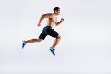 Fototapeta na wymiar Full length body size view of his he nice attractive powerful professional sportive focused purposeful guy jumping running motivation isolated over light white pastel color background