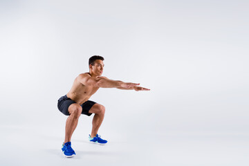 Portrait of his he nice attractive focused sportive guy ripped body doing sit-up spending free time...
