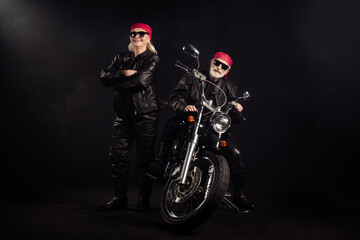 Fototapeta na wymiar Full body photo of old bikers man lady couple drive chopper travel feel young rock moto festival arms crossed wear rocker leather outfit sunglass bandana isolated black color background