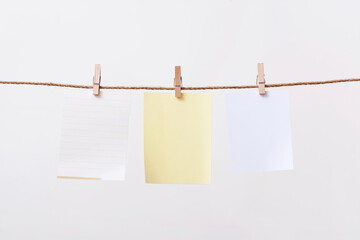 paper cards hanging rope isolated on white background
