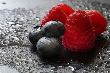 tasty raspberries and blueberries
