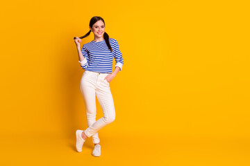 Fototapeta na wymiar Full length body size view of her she nice attractive pretty lovely feminine slim fit thin cheerful cheery brown-haired girl posing isolated on bright vivid shine vibrant yellow color background
